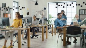 In the Stylish Open Space Office: Diverse Group of Enthusiastic Business Marketing Professionals Use Computers, Have Meetings, Discussing Project Ideas, Brainstorming Startup Company Strategy - Powered by Shutterstock - Get 15% off with code: PIKWIZARD15