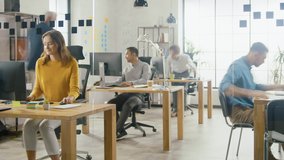 Time-Lapse Shot: Group of Professional Employees Working on Desktop Computers, Walking Through the Busy Office. Talking With Colleagues, Designing Software, Doing Customer Support, Emailing Clients - Powered by Shutterstock - Get 15% off with code: PIKWIZARD15