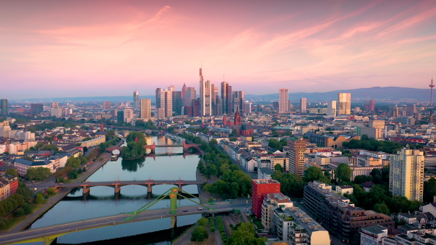 Frankfurt aerial skyline view at sunset, beautiful sunset sky over frankfurt city germany. Royalty-Free Stock Footage #1033983476