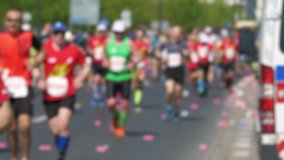 Defocused marathon runners in 4K slow motion 60fps
