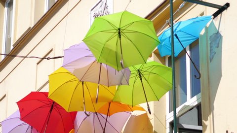 Colorful umbrellas urban street decoration in 4k slow motion 60fps