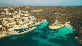 Aerial drone shot, Blue Lagoon island 4k travel video. Eye view on the sea coastline with pier and yacht at sunny day. Travel, journey, islands, Seascape, freedom, holidays concept