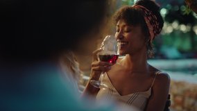 beautiful african american woman enjoying dinner date flirting with man couple drinking wine making toast celebrating romantic evening together 4k - Powered by Shutterstock - Get 15% off with code: PIKWIZARD15