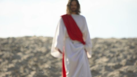Jesus walking to people, preaching Christian faith in desert, soul salvation