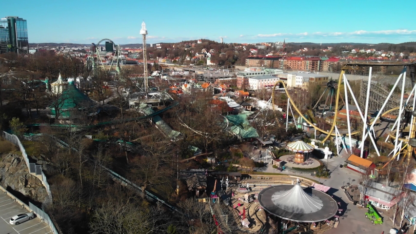 Aerial footage over Liseberg amusement park in Gothenburg. Best park in Sweden with amazing rides. Also showing road E6 in the background.