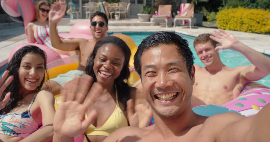 Friends in swimming pool young asian man taking video using smartphone sharing summer vacation on social media happy people enjoying summer day outdoors 4k | Shutterstock HD Video #1034010017