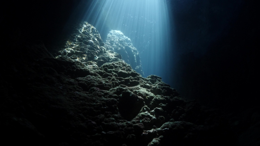 sun beam and rays sun shine underwater in caves and caverns backgrounds Royalty-Free Stock Footage #1034033027