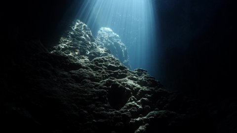 sun beam and rays sun shine underwater in caves and caverns backgrounds