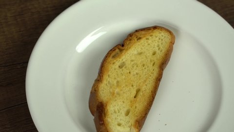 Spreading creamy butter on bread