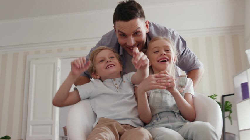 Active Family Group Move in Rent Real Estate. Positive Looking at Relocating or Unpacking of Carton Pack by Playful Dad. Two Caucasian Babies Ride a Chair. Enjoying Life or Dream of Small Child by Day | Shutterstock HD Video #1034046740