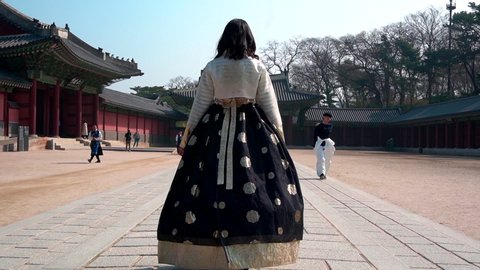 Seoul, Seoul / South Korea - 04 12 2019: Girl Wearing Hanbok Traditional Korean Dress At Gyeongbokgung Palace In Seoul South Korea With Speed Ramp And Transition