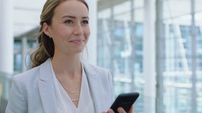 beautiful business woman using smartphone texting walking in corporate office typing text messages on mobile phone checking emails successful female executive at work 4k footage - Powered by Shutterstock - Get 15% off with code: PIKWIZARD15