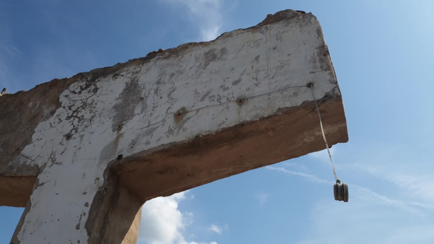 The man and the destroyed building. Man and ruins. Catastrophe. Collapsed building.