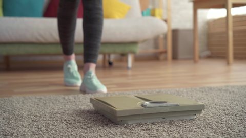 Weight control concept,women's feet on the floor scales