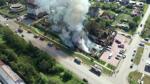YEKATERINBURG, RUSSIA - 26 JULY 2019 : big fire and black smoke shooting from height . Aerial shoot frome drone