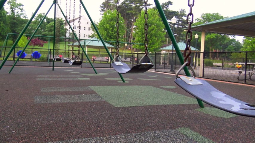 swing set in a park swinging
