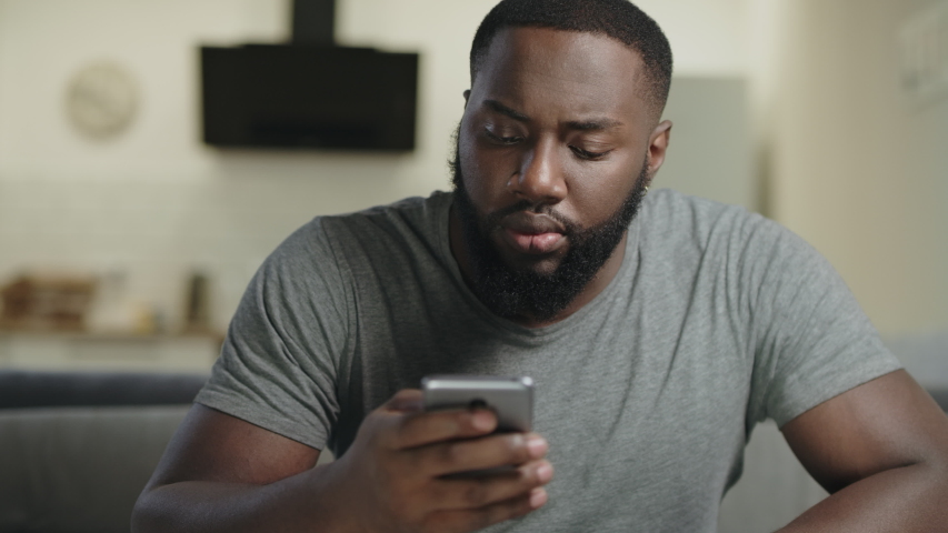 Black Man Holding Phone In Stock Footage Video 100 Royalty Free 1034089193 Shutterstock