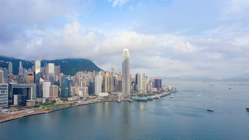 aerial view hyperlapse 4k video of Victoria Harbour in Hong Kong. hyper lapse in hong kong city.  Royalty-Free Stock Footage #1034091827