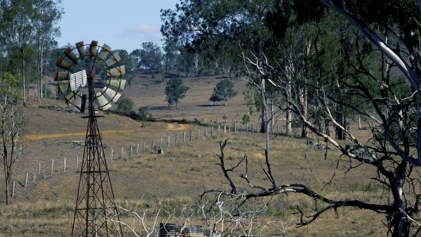 Rustic windmill in the countryside of Queensland, Australia.