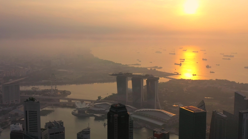 Drone Aerial view 4k Footage of  Singapore City Skyline. Sunrise Royalty-Free Stock Footage #1034101736
