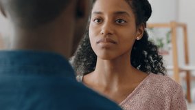 sad young woman touching boyfriends face mixed race couple having relationship trouble emotional issues sharing bad news - Powered by Shutterstock - Get 15% off with code: PIKWIZARD15