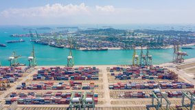 aerial view hyperlapse 4k video of busiest Asian cargo port with hundreds of ships loading export and import goods and thousands of containers in harbor singapore.