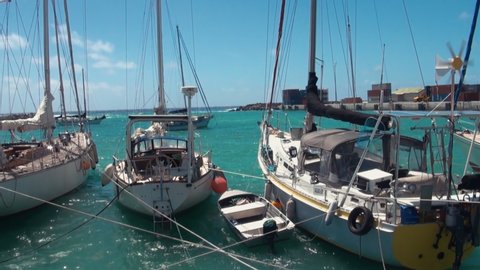 RAROTONGA, COOK ISLANDS - JULY 6, 2013: Port Of Avatiu Or Avatiu Harbour Marina With Boats & Yachts Mooring & Rocking In Swell In Avarua Rarotonga Cook Islands On Suny Day In South Pacific Polynesia