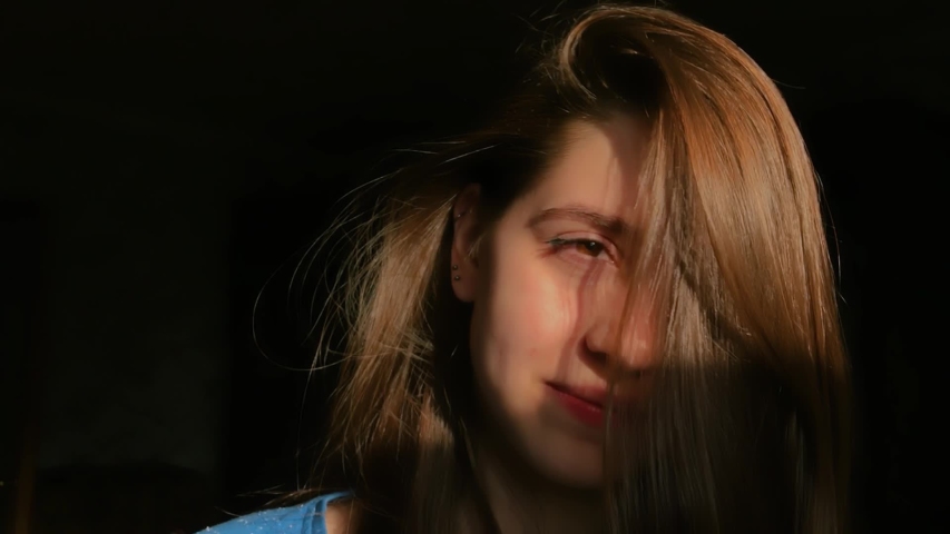 Rotating nice girl with beautiful hair in the sunlight.