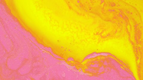 Yellow, orange, pink colors. Abstract Acrylic Color Flow, Liquid Acrylic Painting. Liquid color background design. Fluid gradient shapes composition. Glitter texture 