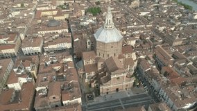 Aerial footage drone view of monuments and skyline of Pavia, beautiful old city town in Italy // no video editing