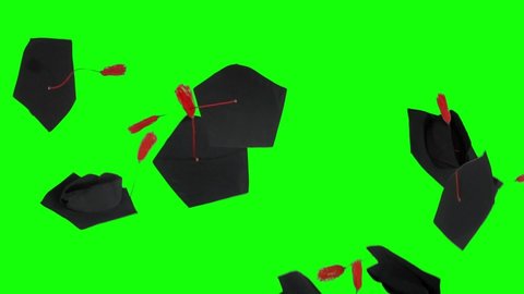 Slow motion of graduation caps thrown on the air in the studio with green screen background
