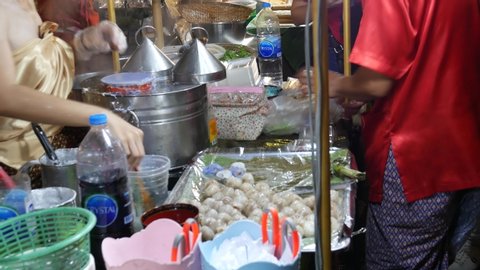 Bangkok, Thailand-January 24, 2019: People buying Steamed rice-skin dumplings with pork filling, Thai dessert, street food in Bangkok. Bangkok is a food lover’s place with variety of food. 