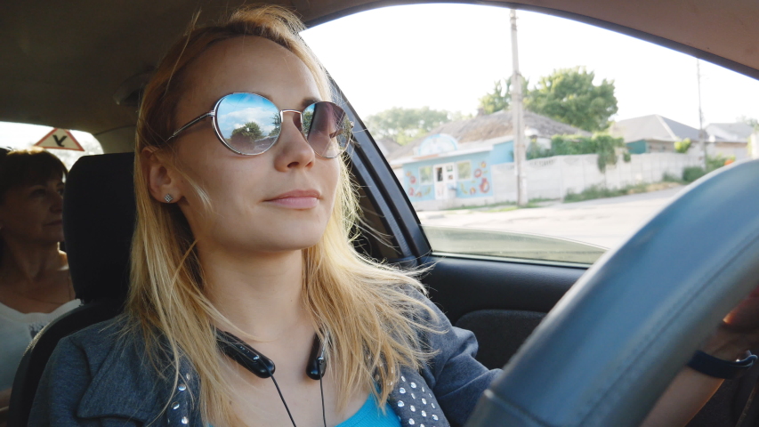 young woman driver driving a car