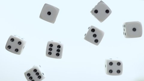 Dice rolling on clear table