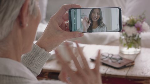 mature woman having video chat using smartphone deaf mother chatting to daughter with sign language enjoying conversation with family on mobile phone hearing impaired communication