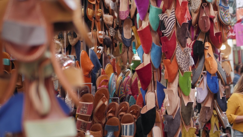 Marrakech - market stalls in Medina old city. Bags and leatherin  morocco marketplace, craftsman product arabian Royalty-Free Stock Footage #1034169662