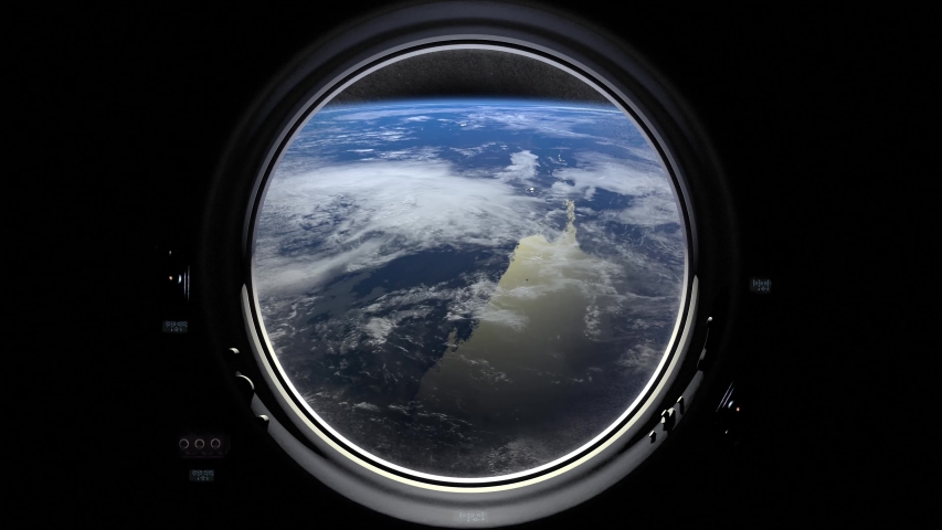 Earth through the porthole window of spaceship. International space station moves to the right. Realistic atmosphere. ISS. 4K. Royalty-Free Stock Footage #1034182259