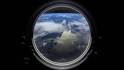Earth through the porthole window of spaceship. International space station moves to the right. Realistic atmosphere. ISS. 4K.