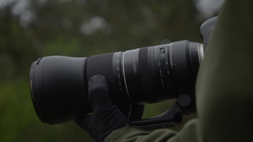 Secret spy photographer hunts for clues in his dark clothing.  Perfect CIA operative clothing working for national security.  Filmed in 4K on a Canon C200.