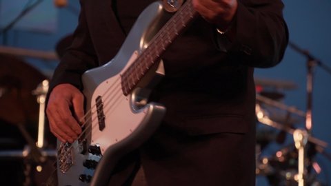 man playing guitar hands close up