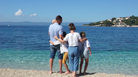 Beautiful family resting on the shores of the Mediterranean. Family holidays on the sea, Adriatic, Croatia