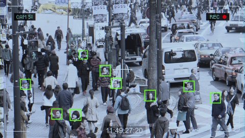 Surveillance camera with face tracking technology recording city life people passing. Artificial intelligence security camera concept. TOKYO, JAPAN - NOVEMBER 2017