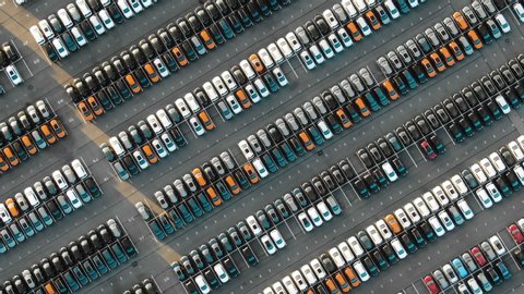 large automobile rows on modern warehouse parking area