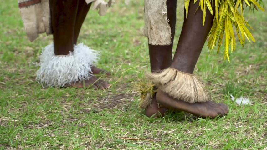 Close up legs and feet of male sing-sing dancers, Papua New Guinea