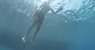 young boy in the sea underwater cine d footage 