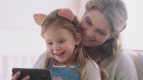 mother and child using smartphone having video chat little girl with mom waving sharing vacation weekend with daughter enjoying chatting on mobile phone 4k footage