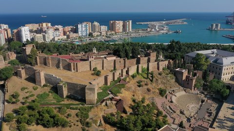 Aerial view of cityscape of Malaga, famous historic city in Costa del Sol (Mediterranean Sea), medieval Moorish fortress/palace Alcazaba - landscape panorama of Andalusia from above, Spain, Europe