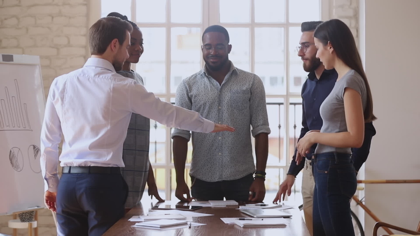 Happy multiracial business team people group stack hands together motivated by corporate success promise partnership union help support in teamwork engaged in teambuilding celebrate victory concept Royalty-Free Stock Footage #1034217707
