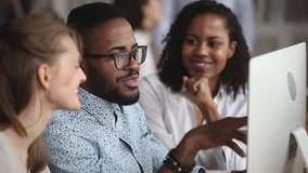 Friendly creative diverse colleagues team discuss online project use computer at workplace, multiracial coworkers group talk work together share ideas on digital marketing strategy at office meeting - Powered by Shutterstock - Get 15% off with code: PIKWIZARD15
