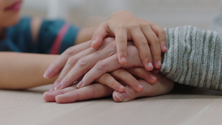 Close up little girl holding grandmothers hand showing affection loving child showing compassion for granny enjoying bonding with granddaughter family concept 4k footage | Shutterstock HD Video #1034219054